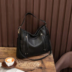 Coralie™ | Usnjena torba s fru-fruji