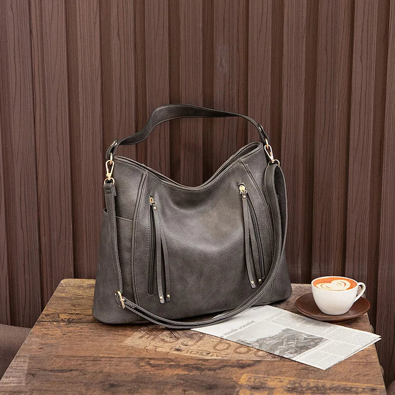 Coralie™ | Usnjena torba s fru-fruji