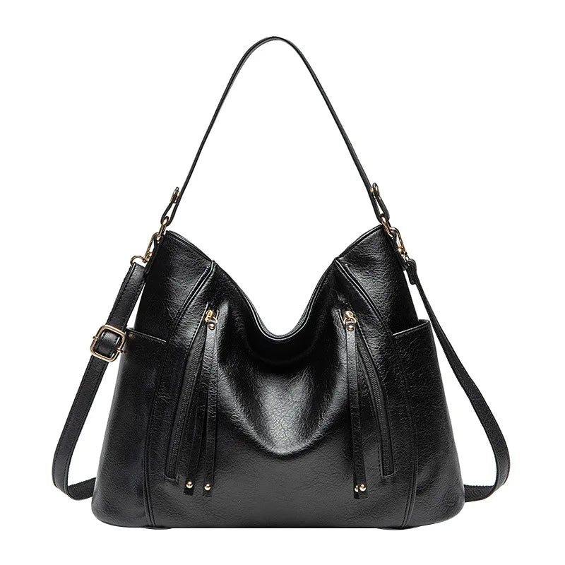 Coralie™ | Usnjena torba s fru-fruji