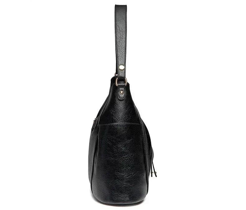 Coralie™ | Bolsa de cuero con flecos