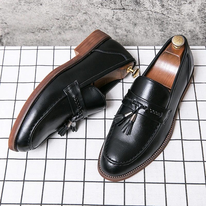 Mocasines de cuero con borlas