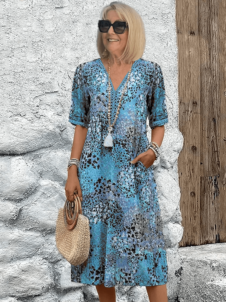 Elaisa | Elegantna Cvečna Midi Obleka
